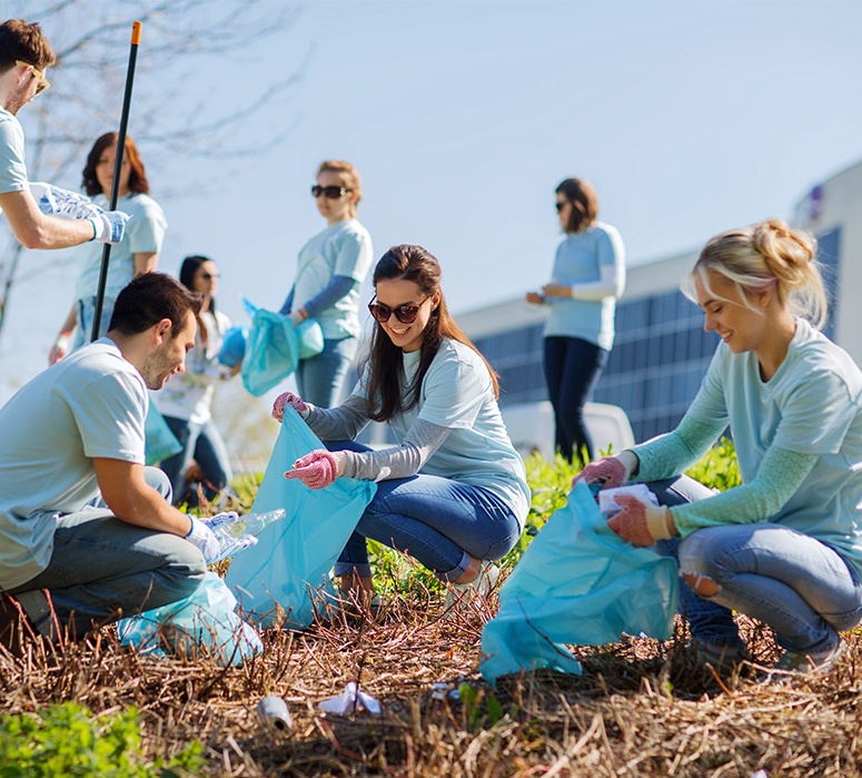 Dental team members participating in community cleanup event