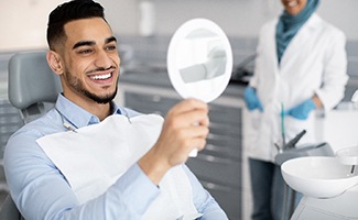 A young man after dental implant placement 