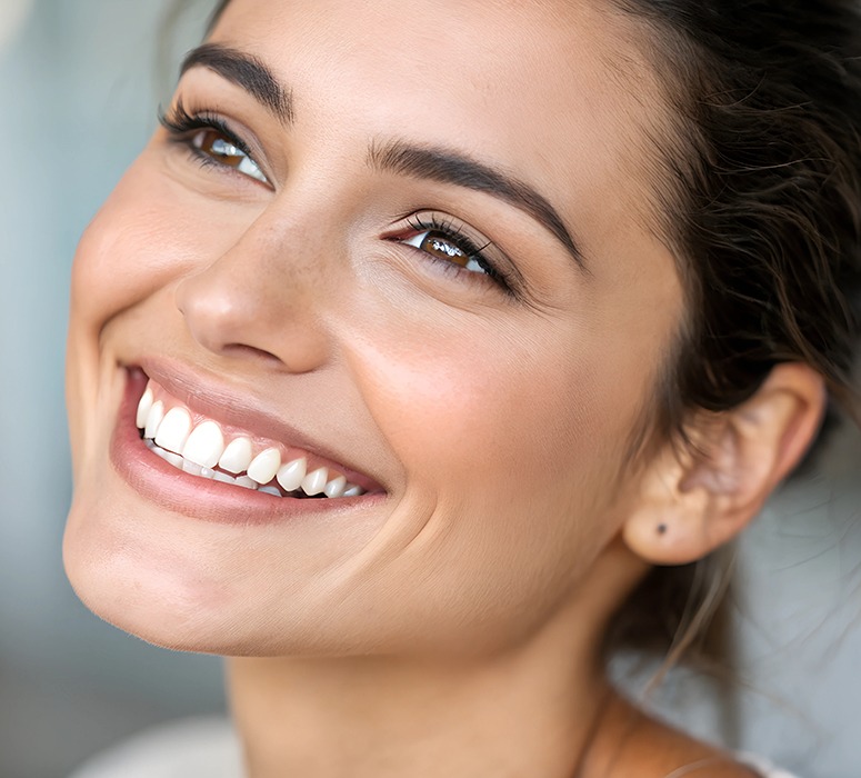 Close-up portrait of smiling woman with beautiful teeth