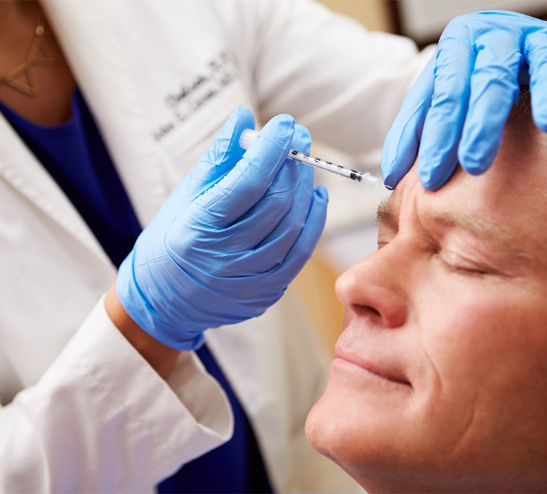 Woman smiling after receiving a same day dental crown