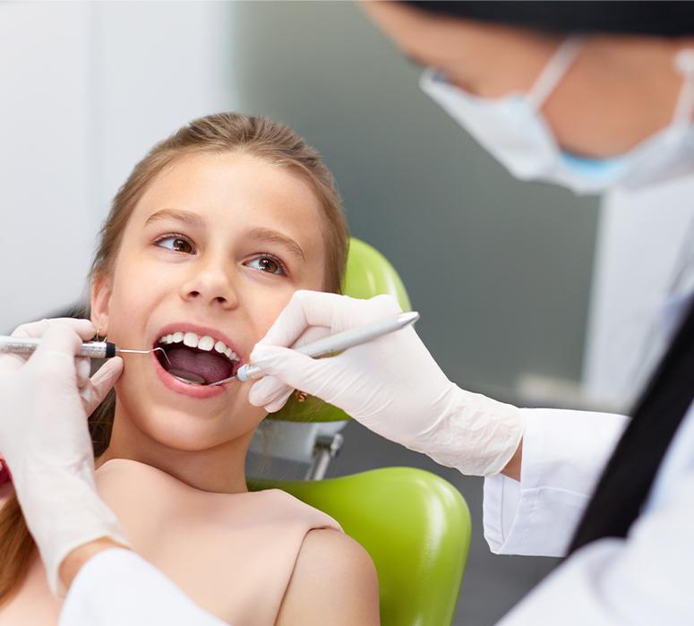 Young girl receiving children's dentistry checkup