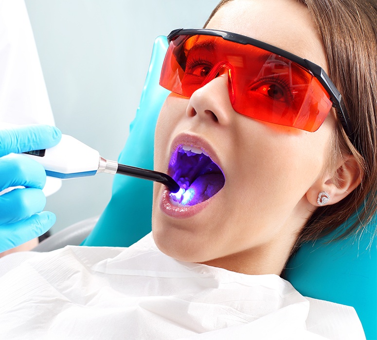 Patient receiving dental sealants