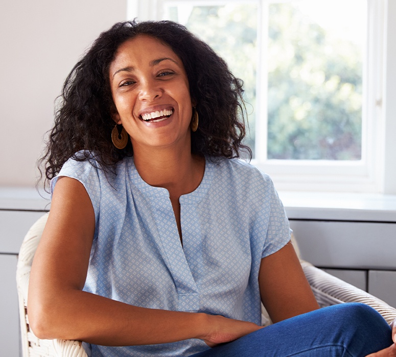 Woman with porcelain veneers smiling