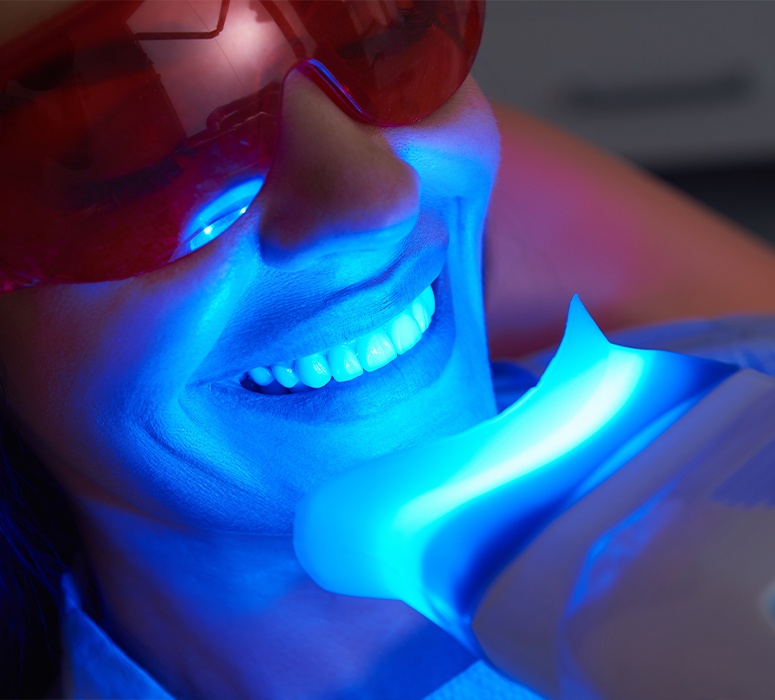 Patient receiving in office zoom teeth whitening