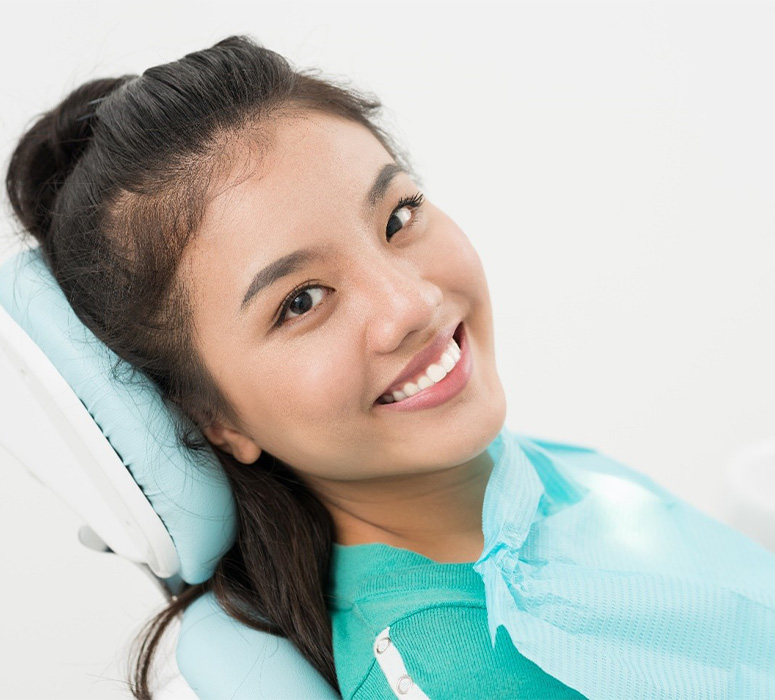 Mother and daughter at reception desk for emergency dentistry