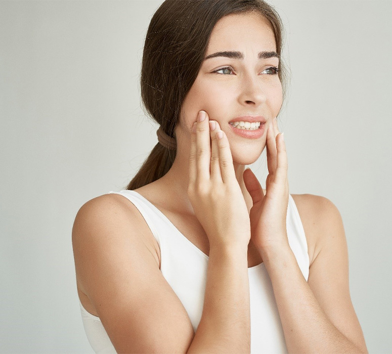 Mother and daughter at reception desk for emergency dentistry