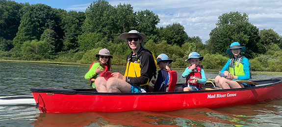 Doctor Koops and his family canoeing