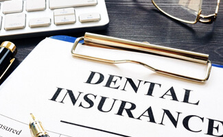 a dental insurance form placed on a desk