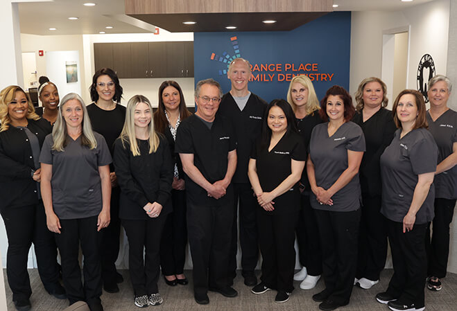 Smiling dentists and team members at Orange Place Family Dentistry in Beachwood