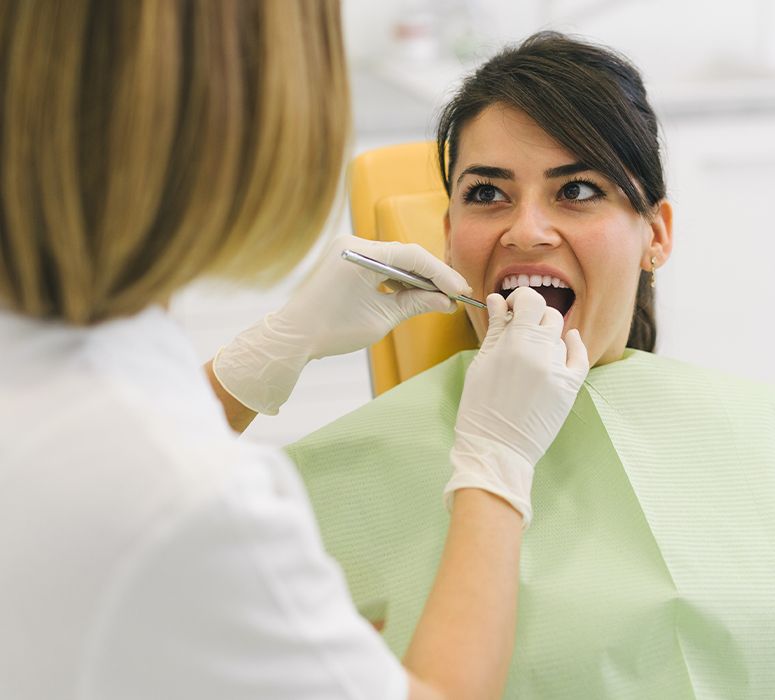 Woman receiving dental treatment