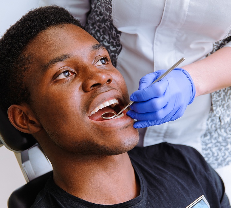 Man receiving preventive dentistry checkups