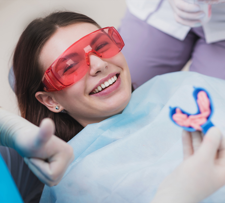 Patient smiling after fluoride treatment