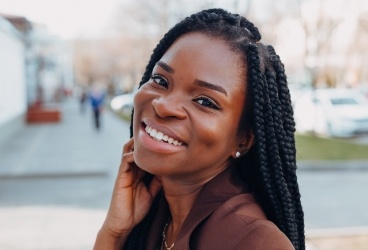 Woman with flawless smile after cosmetic dentistry