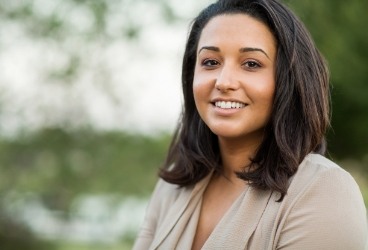 Woman smiling after periodontal therapy