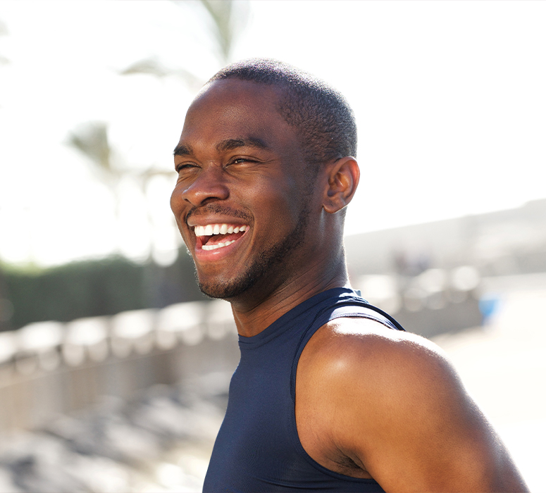 Man smiling after tooth colored filling restoration