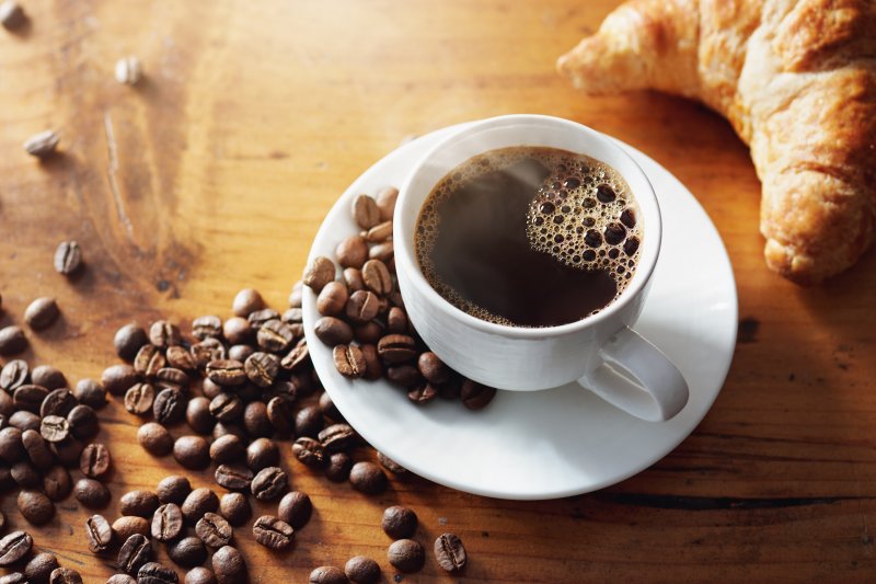 cup of hot coffee on table