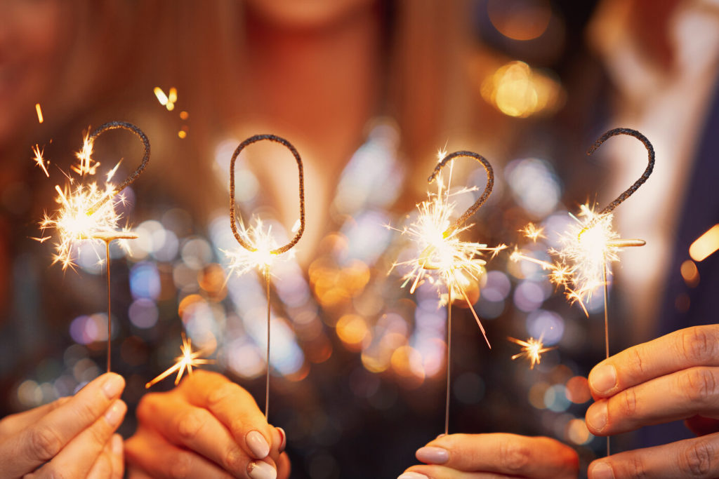 people holding 2022 sparklers