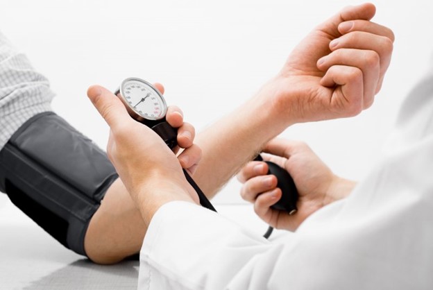 Man checking blood pressure.