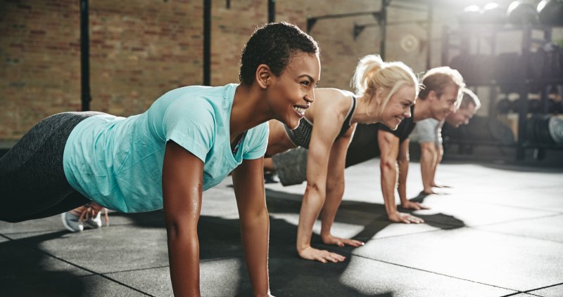 women smiling while exercising