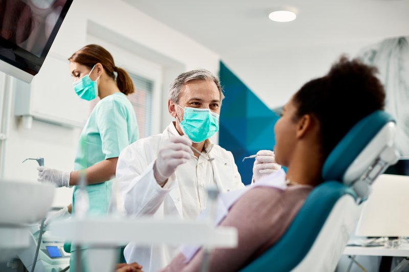 patient talking to their dentist at a checkup